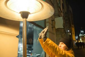 Tall mushroom-style outdoor terrace heater glowing warm on a chilly winter evening